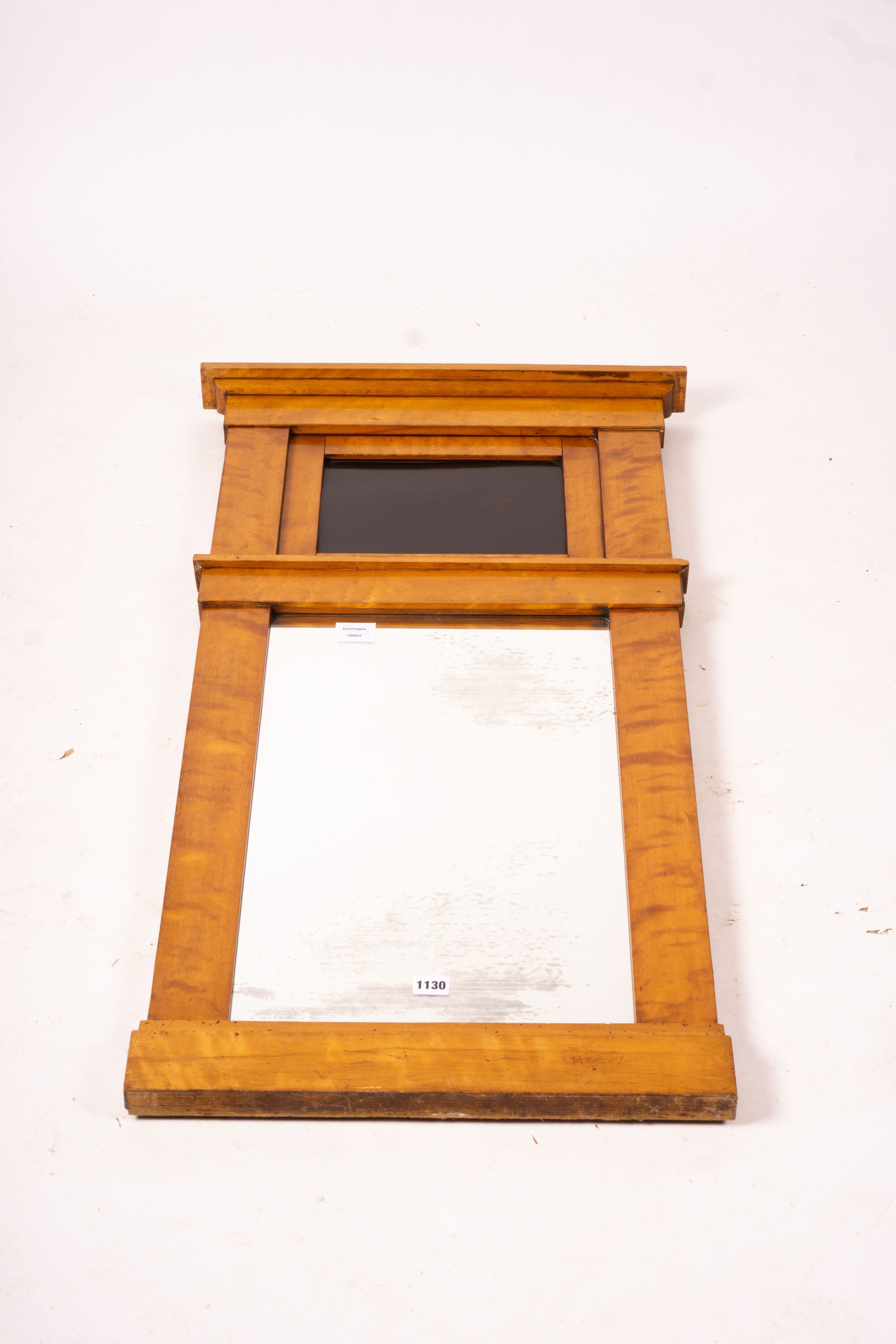 A Biedermeier style maple wall mirror, width 52cm, height 109cm